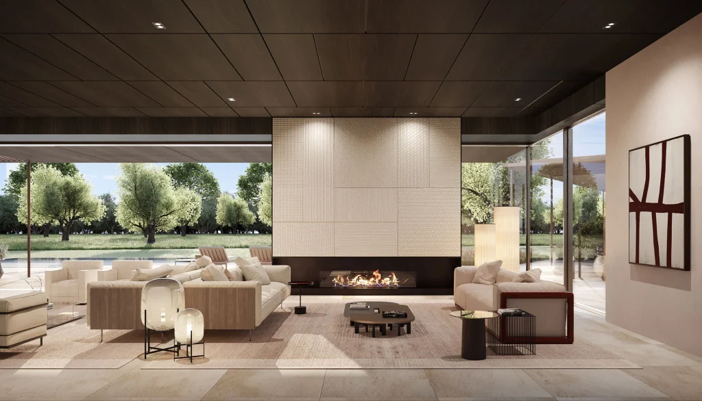 Minimalist luxury living room with a wide modern fireplace, cream sectional sofas, and floor-to-ceiling glass doors opening to outdoor greenery. top interior design firms in milan
