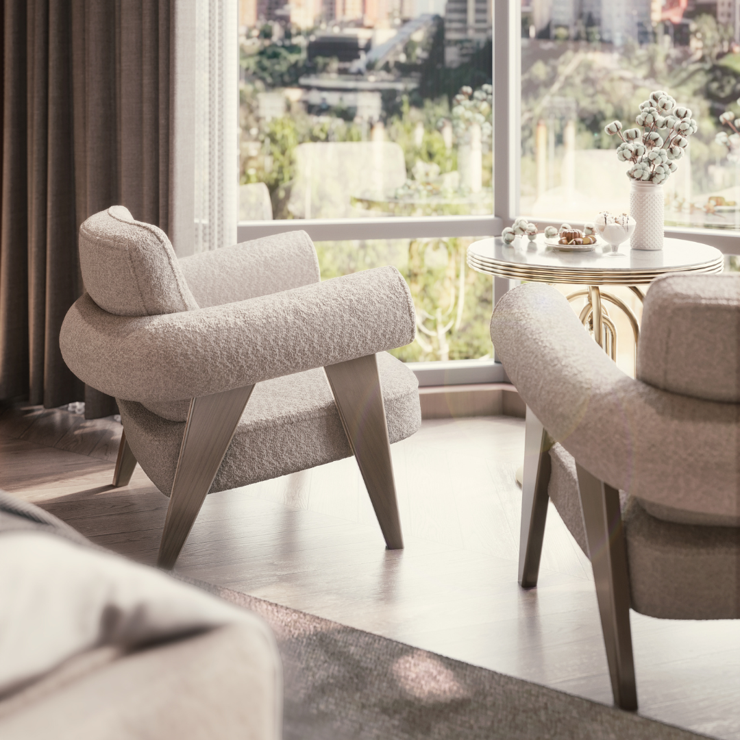bouclé furniture Ghibli armchair with walnut legs placed beside a plush bed in a serene bedroom setting