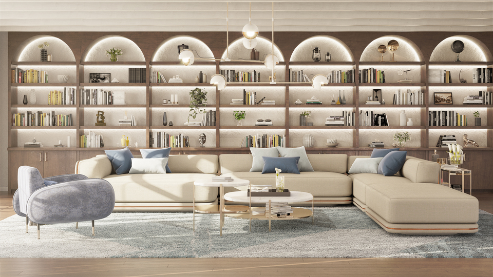 Elegant living room with a beige sectional sofa, a grey velvet armchair, and a lit arch-built-in bookshelf filled with books.